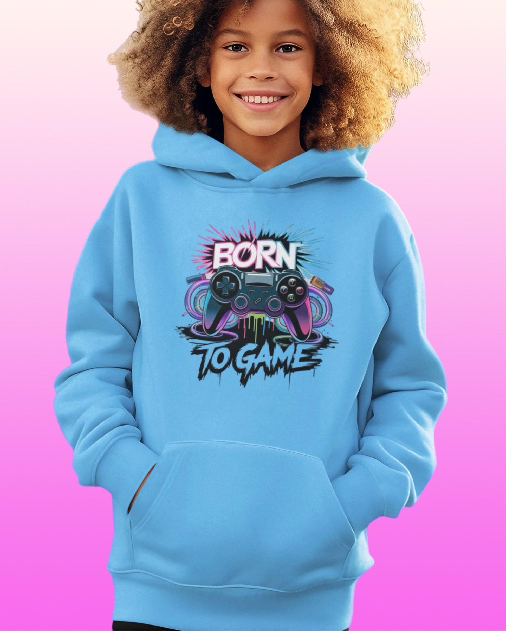 Child wearing a blue hoodie with 'Born to Game' design on a pink and purple gradient background