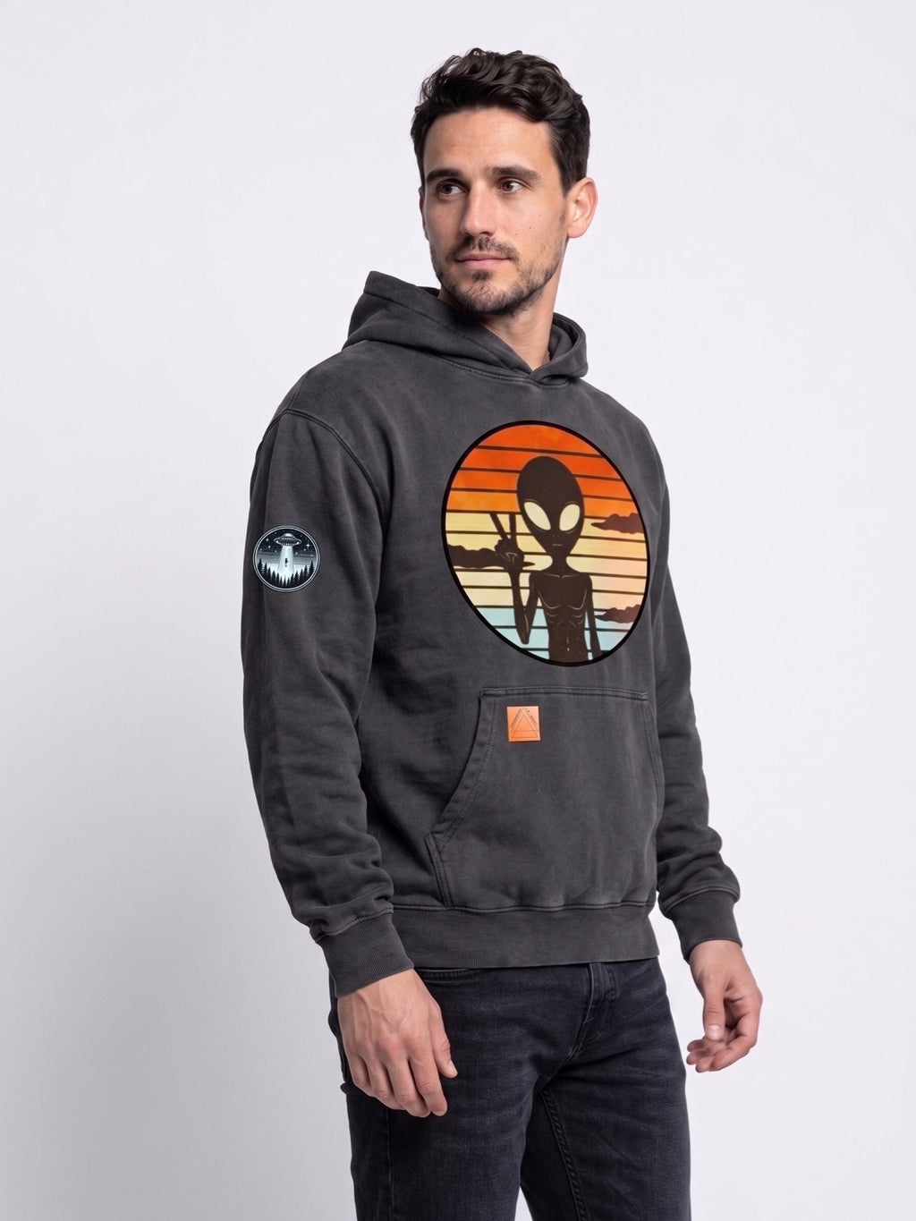 Dark gray hoodie with alien graphic print on chest and front kangaroo pocket