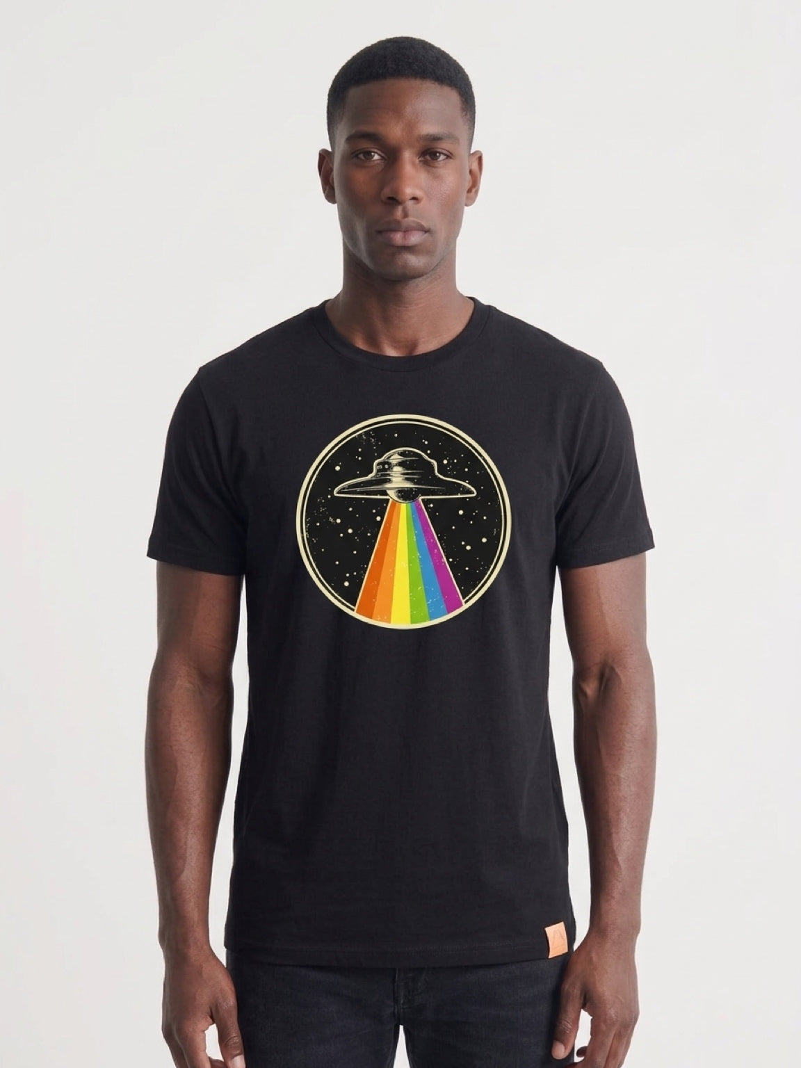 T-shirt with a circular graphic of a UFO and a rainbow beam of light 