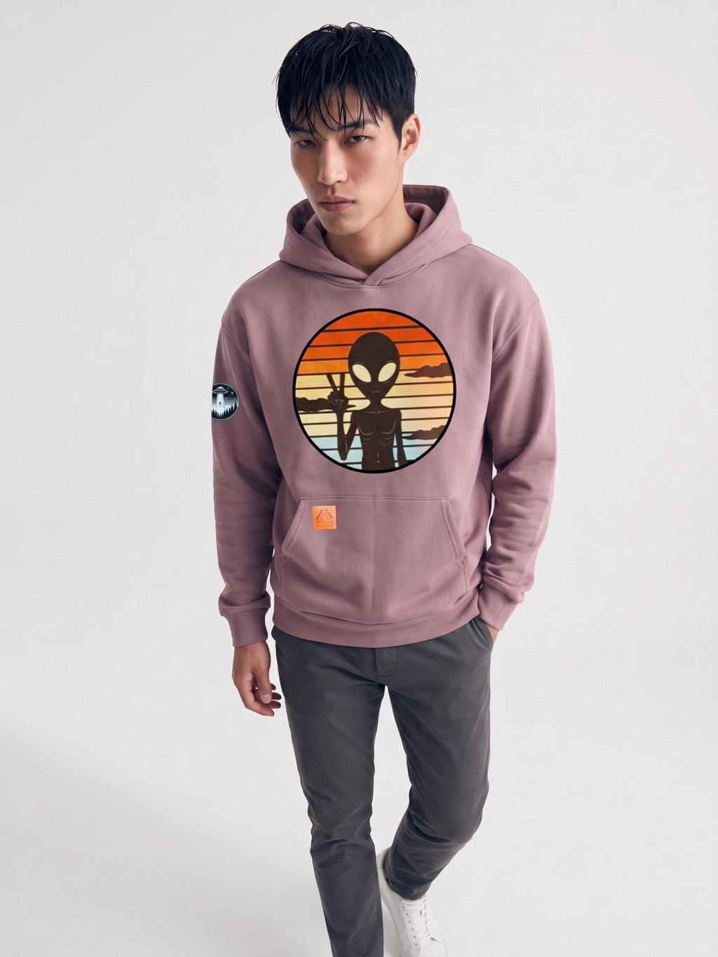 Dusty rose hoodie with alien circle graphic on chest and front kangaroo pocket